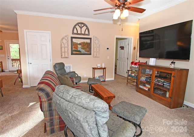 carpeted living room with ceiling fan and ornamental molding