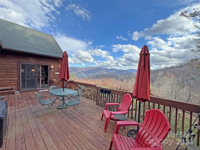 wooden terrace with a mountain view