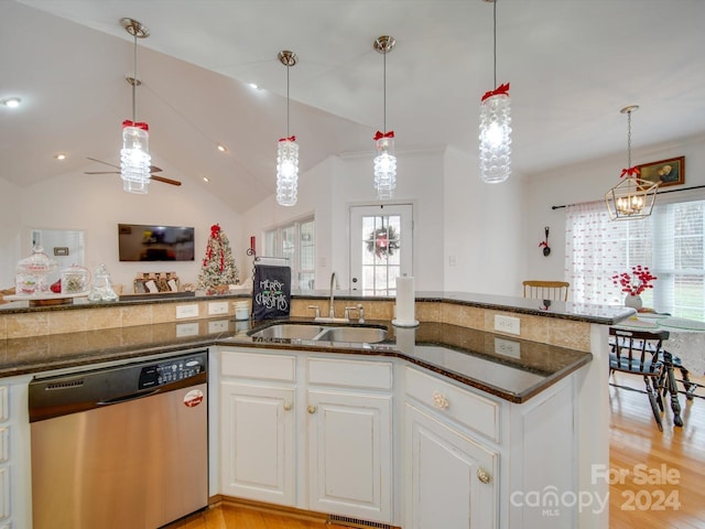 kitchen with dishwasher, white cabinetry, sink, and decorative light fixtures