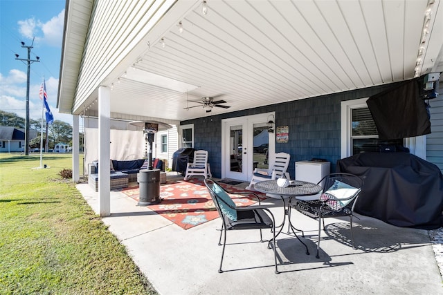 view of patio featuring ceiling fan, area for grilling, an outdoor hangout area, and french doors