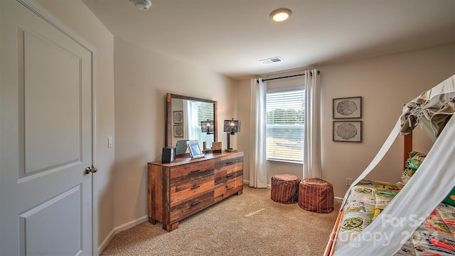 bedroom with light carpet