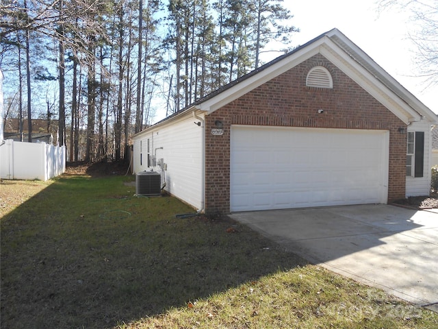 view of property exterior featuring a garage, a lawn, fence, central AC, and brick siding