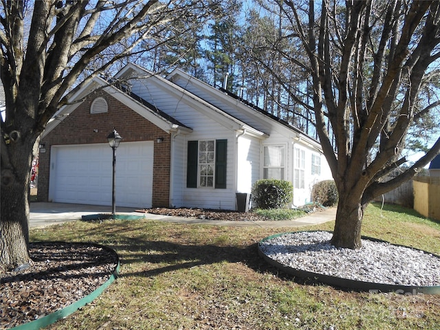 view of front of home with concrete driveway, brick siding, and an attached garage