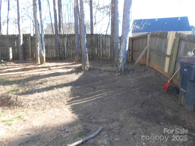 view of yard with a fenced backyard