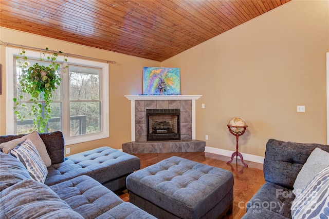 living room featuring a fireplace, wood-type flooring, wooden ceiling, and lofted ceiling