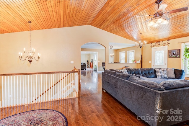 living room featuring ceiling fan, dark hardwood / wood-style flooring, wood ceiling, and vaulted ceiling