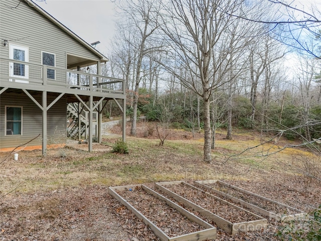 view of yard featuring a wooden deck