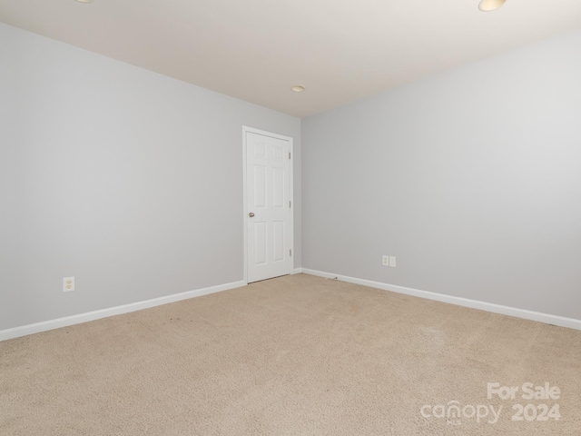 empty room with carpet flooring