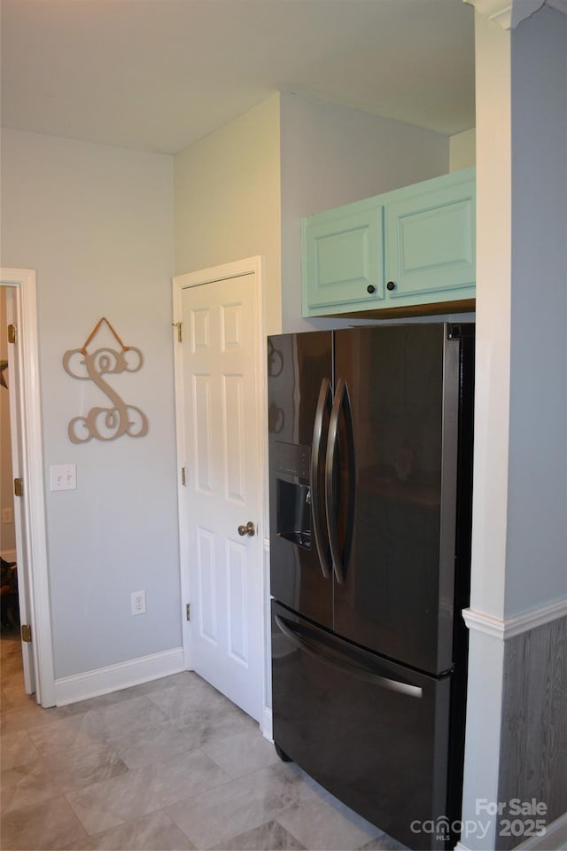 laundry room featuring washing machine and clothes dryer and cabinets