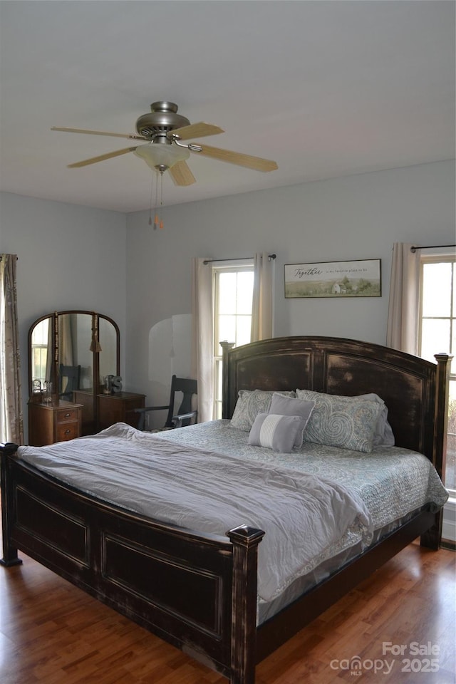 bedroom featuring ceiling fan and hardwood / wood-style floors