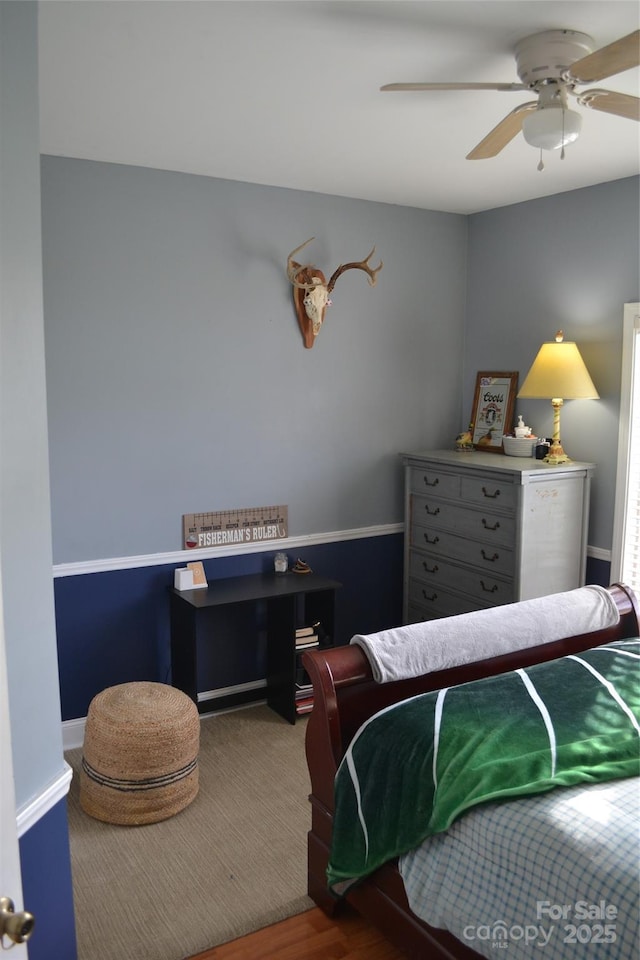 bedroom with hardwood / wood-style flooring and ceiling fan