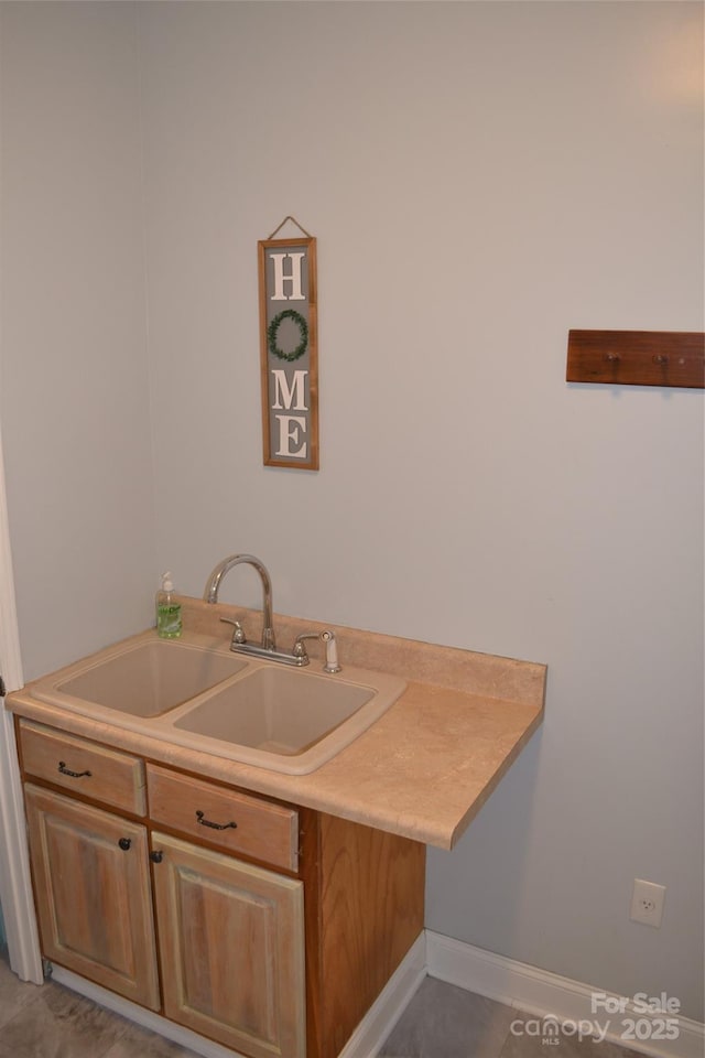 kitchen featuring sink and tile patterned floors