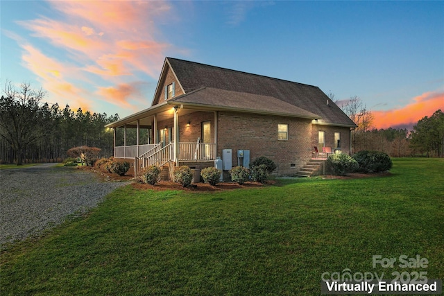 158 White Rd, Wadesboro, NC 28170 - view of front facade with brick siding, crawl space, a shingled roof, and a yard