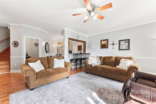 158 White Rd, Wadesboro, NC 28170 - living room featuring crown molding, baseboards, stairway, wood finished floors, and a ceiling fan
