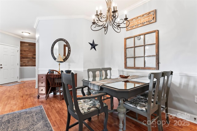 158 White Rd, Wadesboro, NC 28170 - dining room featuring light wood-style flooring, ornamental molding, and a chandelier
