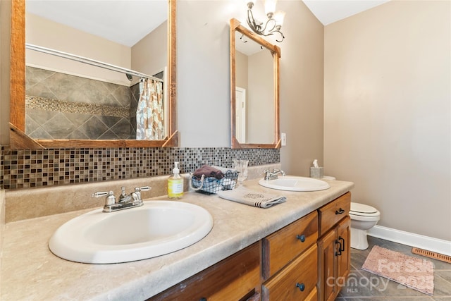 158 White Rd, Wadesboro, NC 28170 - full bath with decorative backsplash, toilet, baseboards, and a sink
