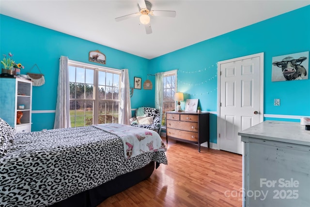 158 White Rd, Wadesboro, NC 28170 - bedroom with a ceiling fan and wood finished floors