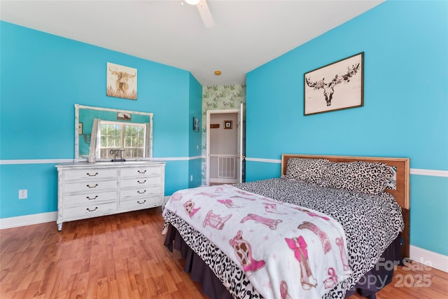158 White Rd, Wadesboro, NC 28170 - bedroom featuring baseboards, wood finished floors, and a ceiling fan