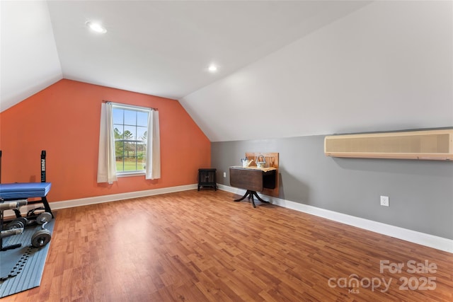 158 White Rd, Wadesboro, NC 28170 - unfurnished office featuring vaulted ceiling, a wall mounted AC, baseboards, and wood finished floors