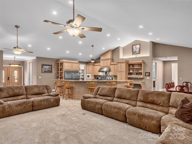 living room with light carpet, recessed lighting, high vaulted ceiling, and a ceiling fan