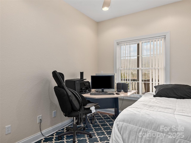 bedroom featuring baseboards