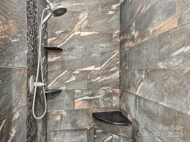 details with a tile shower