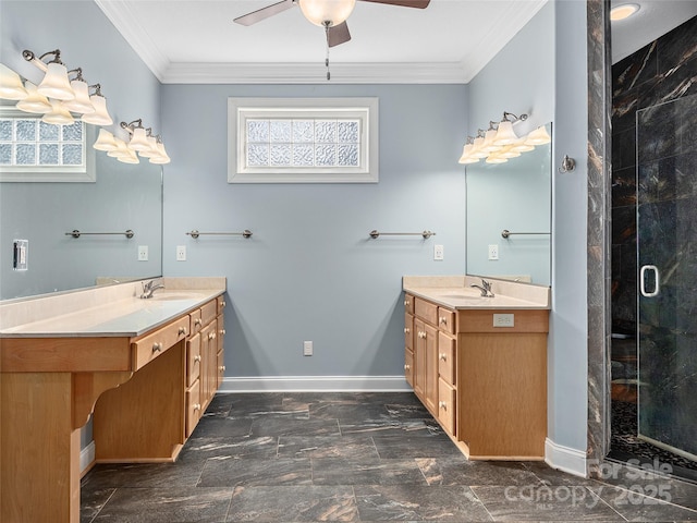 full bath featuring baseboards, two vanities, ornamental molding, and a shower stall