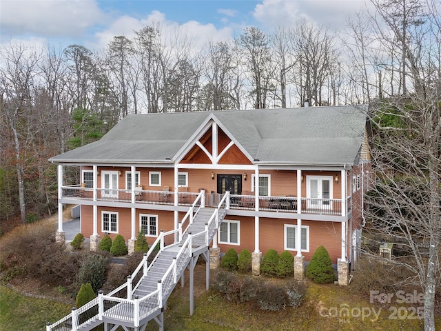 view of front of property featuring french doors and stairs