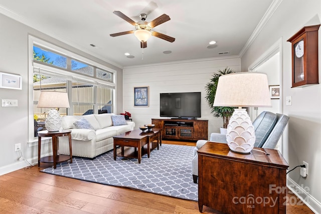 5019 Pleasant Run Dr, Matthews, NC 28104 - living area featuring ceiling fan, crown molding, wood finished floors, and recessed lighting