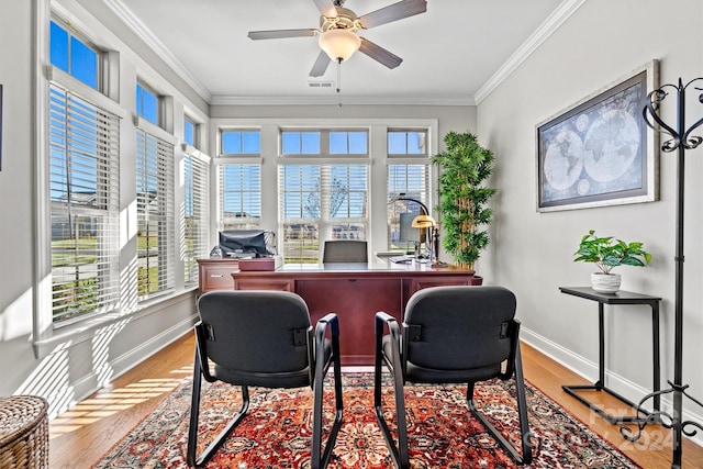 office with a water view, light hardwood / wood-style flooring, ceiling fan, and crown molding