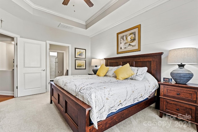 carpeted bedroom with ceiling fan and ornamental molding