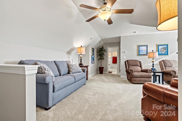 living room with ceiling fan, light colored carpet, and lofted ceiling