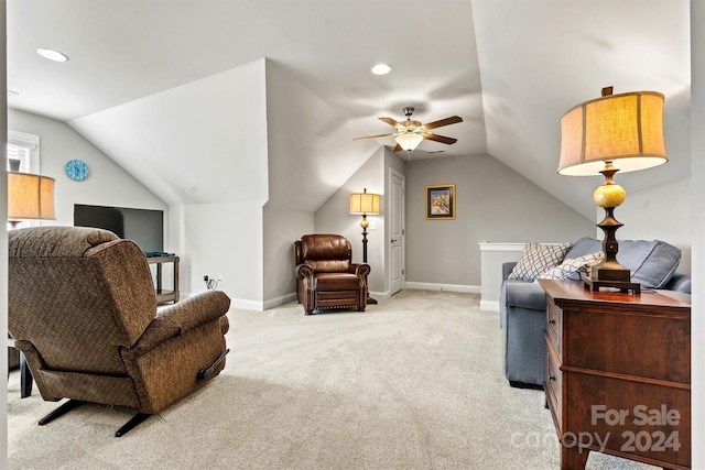 interior space with light carpet, ceiling fan, and vaulted ceiling