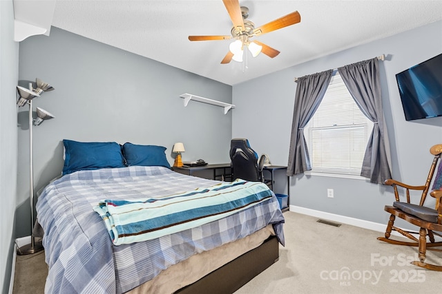 bedroom with ceiling fan and light carpet