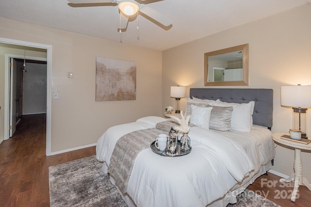 bedroom with ceiling fan and dark hardwood / wood-style floors