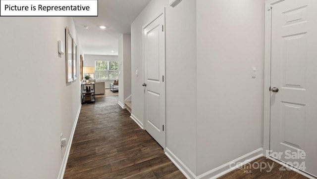 hall with dark hardwood / wood-style floors