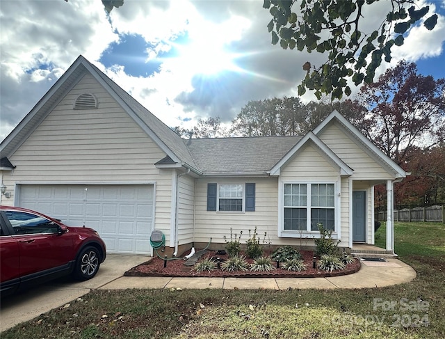 view of front facade featuring a front yard and a garage