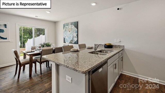 kitchen with dishwasher, sink, light stone counters, dark hardwood / wood-style flooring, and white cabinets