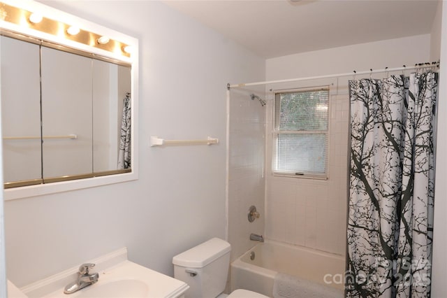 full bathroom with vanity, shower / bath combo, and toilet