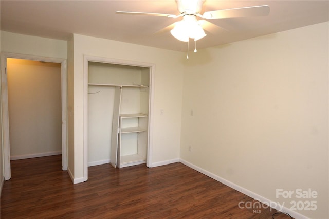 unfurnished bedroom with ceiling fan, a closet, and dark hardwood / wood-style floors