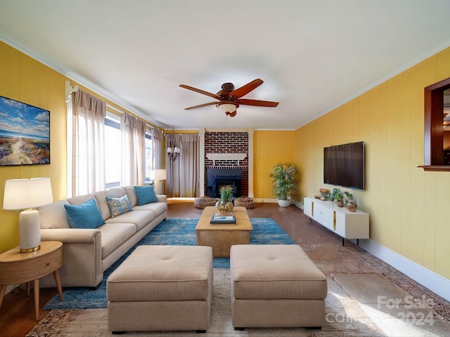 living room with ceiling fan, ornamental molding, and a fireplace