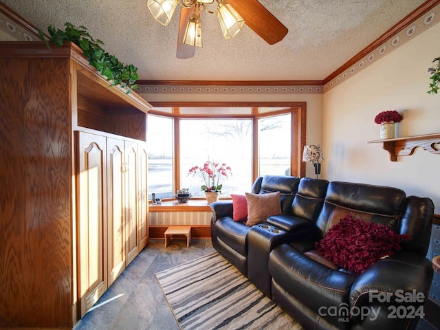 carpeted living room with ceiling fan, ornamental molding, and a textured ceiling