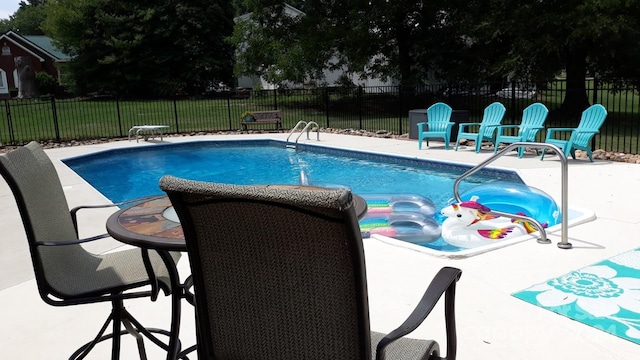 view of swimming pool featuring a patio