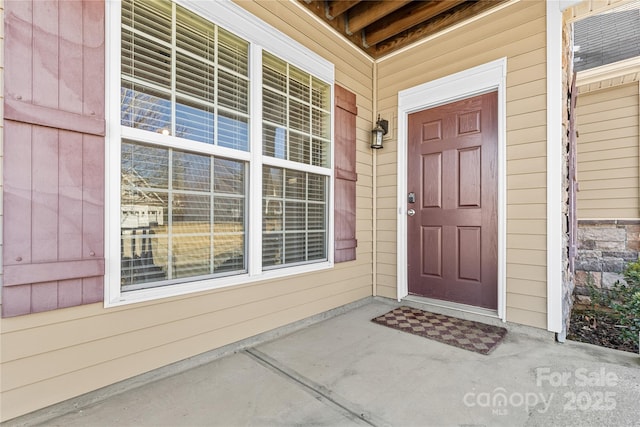 doorway to property with a porch