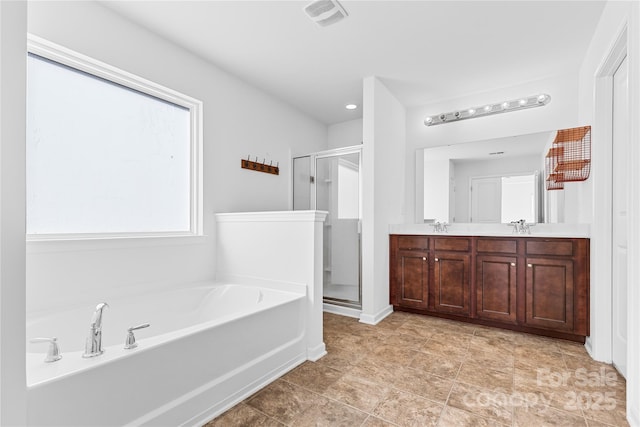 bathroom with shower with separate bathtub and vanity