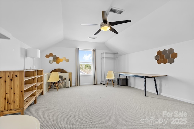 interior space featuring carpet flooring, ceiling fan, and vaulted ceiling