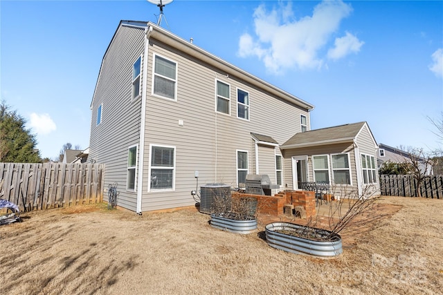 rear view of property featuring cooling unit