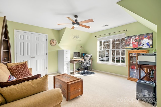 carpeted office featuring vaulted ceiling and ceiling fan