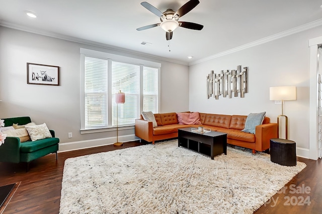 living room featuring dark hardwood / wood-style floors, ceiling fan, and crown molding