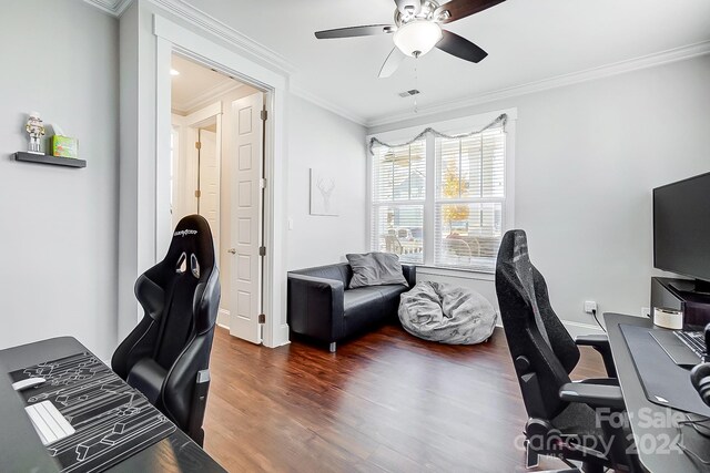 office area with ceiling fan, dark hardwood / wood-style floors, and ornamental molding